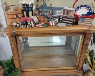 Americana decor and beautiful lighted cabinet.