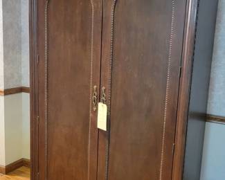 Very nice Armoire. Can be used for hanging clothes or for a television.