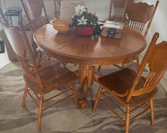 Claw foot dining table with one leaf and 6 matching chairs