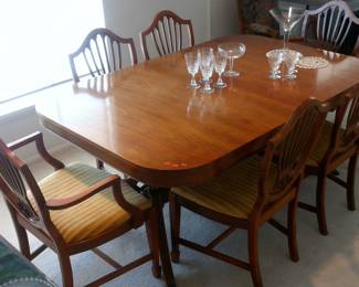 Duncan Phyfe style dining set.  Purchased at J.C. Penny's.  Included table pads
