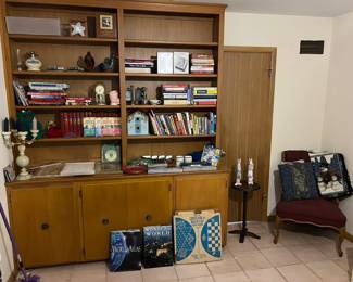 A wide assortment of books, furniture and other items.