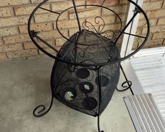 Metal table base with caged candle holder