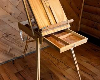 Artist’s Wooden Travel Easel combines portability with sturdy craftsmanship. Designed for painting indoors or outdoors, it folds compactly for easy carrying and storage. Adjustable to multiple angles, it securely holds canvases while providing a reliable workspace for artists on the go. 