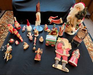 A festive assortment of Santa figures, each with unique charm and character. From classic jolly St. Nicks in red velvet suits to rustic, old-world Father Christmas styles, this collection highlights a variety of sizes, materials, and designs. 