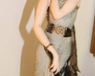 Porcelain figurine , roaring 20's woman with a peacock