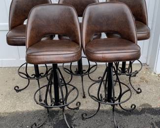 Five wrought iron and vinyl covered bar stools