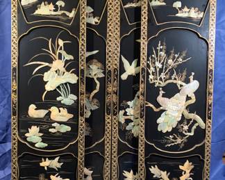 Four hanging lacquered panels with semi-precious stone and mother of pearl embellishments.