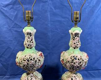 Pair of intricate Capodimonte lamps on pierced metal bases.