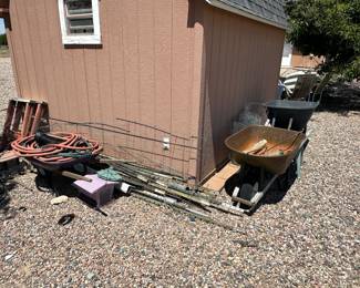 Hoses, tree stakes, wheel barrels, chicken wire.