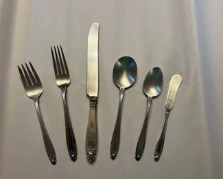$375 (full settings) and $55 per (individual pieces) Delightful full settings and individual pieces of Prelude  silver service settings by International Silver.  Prelude by International isn't your ordinary silverware pattern! Designed by Alfred G. Kintz, this stunning design features a scalloped tip with a floral garland design, a beveled edge, and a glossy finish. As you can see, its popularity is well-earned!