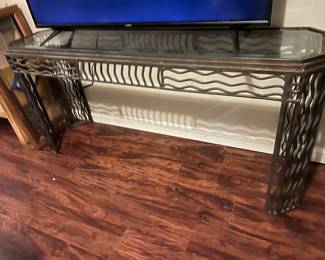 $1,500 - Beautiful hand-crafted metal and glass table H 28" - L 60" - W 16"  glass has some blemishes, but, the piece is an amazing addition to any room.  