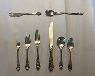 $495 (full settings) and $95 per (individual pieces) Delightful full settings and individual pieces of Sir Christopher silver service by Wallace Silver. Named in honor of the famed British architect Sir Christopher Wren, this beautiful Wallace flatware pattern features an intricately scalloped body further accented with a floral study and distinct scrollwork. This is a classic silverware design that will look dazzling on any table!