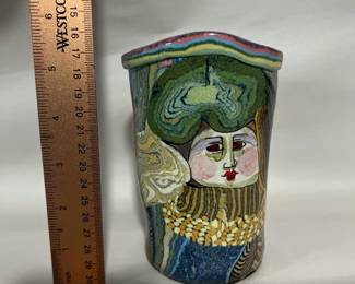 $1,150 - Original Jane Peiser piece.  Jane Peiser is known for multi-colored porcelain hand build forms including small sculptures. She used this process to create intricate patterns and subtle color gradations. This process results in unique pieces of visually complex integral patterns.  Often pattern gives way to representational scenes filled with flowers and animals. She uses relief pieces of either solid colored clay or patterns to add another dimension to her work.  Most of her work is salt glazed. “I’m looking back on 75 years of life on this amazing earth, 45 years in which it has been my great privilege to earn a living making pottery. 
