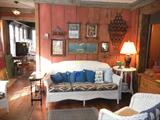 wicker couch (part of set), Currier and Ives, etc. framed prints, wicker end table, smoking stand...