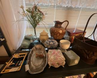 Bedroom - top of shelf -metal can on left, pitcher, & collectibles