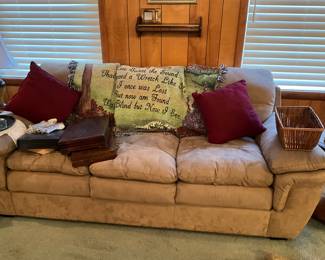 Living room sofa in great condition - shelves & picture , basket, throw, & 3 sets of silver plate silverware in original boxes
