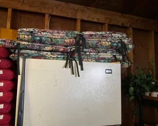 Cushions on top of refrigerator in garage 