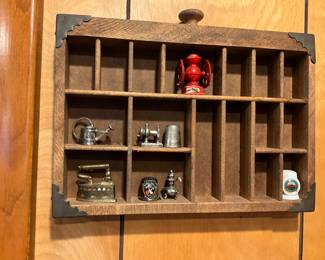 Collectibles in divided wall tray