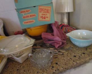 Lots of Pyrex, tins, flower power vintage towels