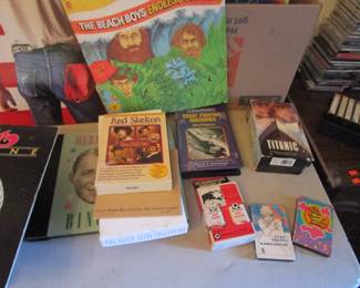 Record room with 100's of records including rock, cassettes, 100's of VHS tapes, DVD's and more.