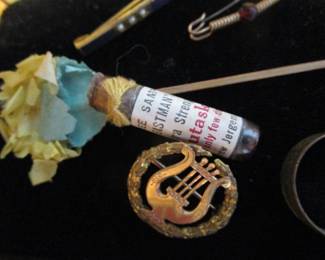 Advertising sample on stick with flower early 1900's