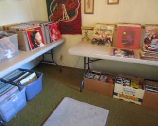Record room with 100's of records including rock, cassettes, 100's of VHS tapes, DVD's and more.