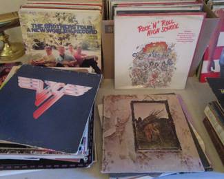 Record room with 100's of records including rock, cassettes, 100's of VHS tapes, DVD's and more.