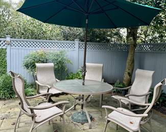 Tropitone Outdoor Round Table, Six Chairs, Umbrella and stand.