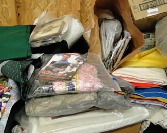 Vintage fabric all over the place, boxes of it