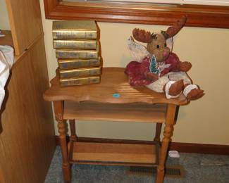 Side table, and collection of books, and a moose too
