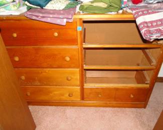 Solid wood dresser, no it is not missing those three drawers, we have then displayed on a table, with sewing notions