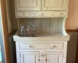 White cottage chic cabinets- Vintage milk carrier with bottles