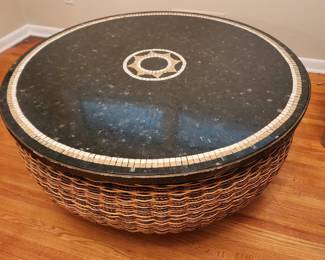 Huge heavy duty basket with a inlaid top. Great unique coffee table