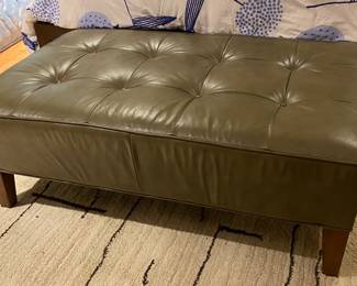 Large olive green ottoman,
feels like leather