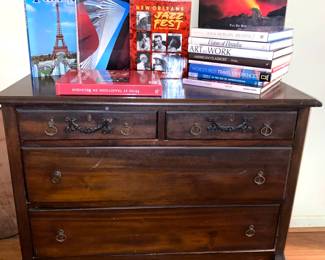 Dresser with mirror and cast rollers