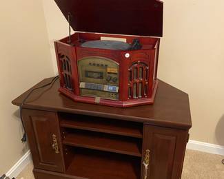 TV stand, record/CD/cassette player, plus vinyl albums, cassettes, CDs, DVDs, VHS tapes