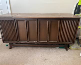MCM console. Classic! 8 track, record player, radio. Powers up. $225.00.