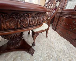 The dining room set matches the office set.  This includes 2 leaves, 8 chairs, and the china cabinet.  