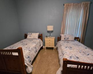 Twin beds. Can be converted to bunk (hardware & materials included). Nightstand & lamp.