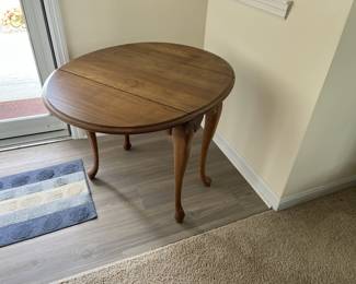 Solid wooden table with drop sides. 75.00.