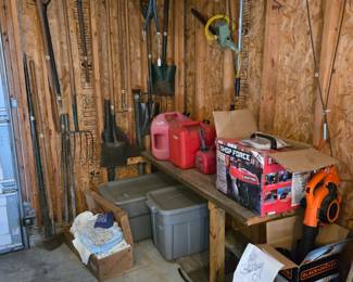 Garage filled with Tools & Equipment:  Yard Tools, Gas Cans, Shop Force Portable Generator, Black & Decker Blower and much more!!