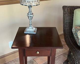 Cherry wood side table with candle lamp