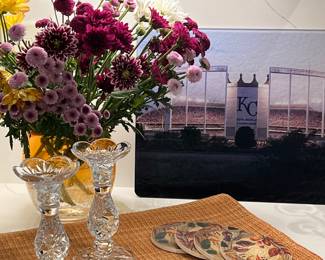 KC Stadium cutting board, beautiful set of placemats, and crystal candleholders