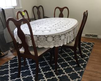 Cherry finish Dining Table and six chairs comes with pads and 2 leafs