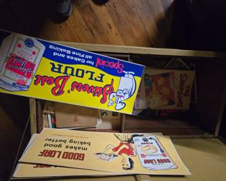 Several cardboard Adverising signs.