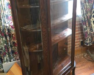 Oak bow front china cabinet /4 shelves.