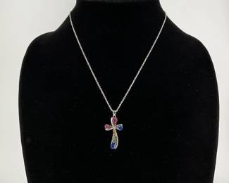 Silver plated multi colored crystal 1 1/2" cross on a 17" chain. Appears new.