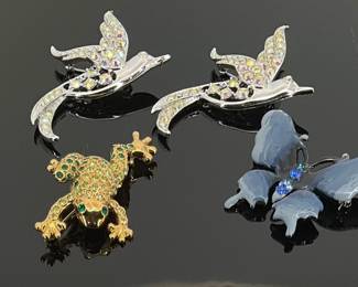 Crystal Animal Pins: (2) Sarah Coventry hummingbird pins full of aurora borealis crystals, (1) Monet "Leapfrog" gold tone and full of sparkling green rhinestones and (1) blue enamel butterfly with blue rhinestones down the center. All approximately 2".