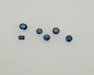 (6) Blue Topaz and Sapphire gemstones, various shapes and sizes. 1.05 ctw.