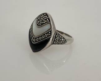 Sterling Silver size 10 ring with marcasite, mother of pearl and black onyx design. 8.69 gtw.